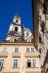 Fototapeta na wymiar Facade of the antique and beautiful Saint Nicholas church at Prague old town