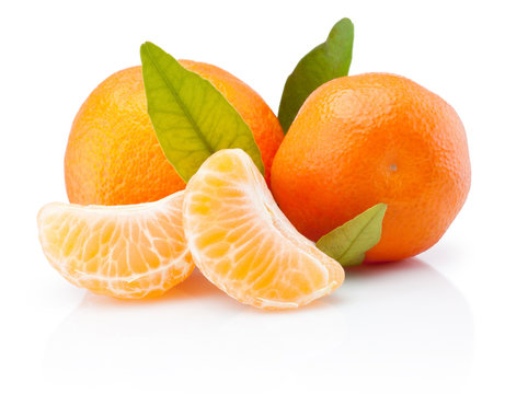 Two tangerines with leaves and peeled pieces isolated on white background