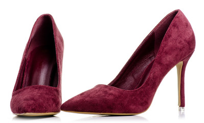 Female red suede high heels shoes on white background isolation