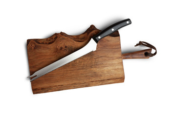 Knife Serrated for kitchen on old wooden cutting Board