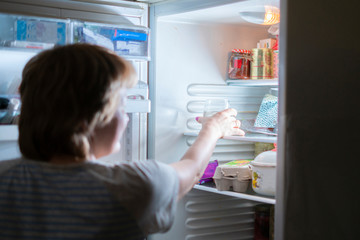 woman driink water from fridge at midnight b