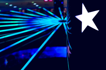 Blur background effect and star image in the foreground. Photo with the effect of bokeh in the form of holy rays