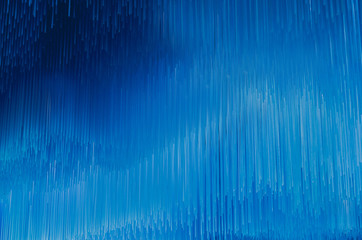 Texture of numerous colored lines. Background of luminous lines. Abstract picture of repeating lines of different shades