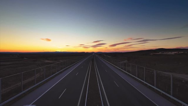 Driving on open road at sunset to the new year 2019. Aerial drone view.