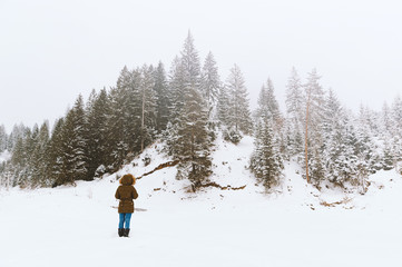 Picture of handsome at the foot of the hill in winter season