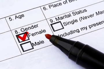 Choice of gender in the application form. Pen and question mark