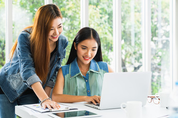 Business meeting. Young asian coworker woman team making business discussion in modern home office. Teamwork people concept. Casual account manager crew working new startup project on laptop