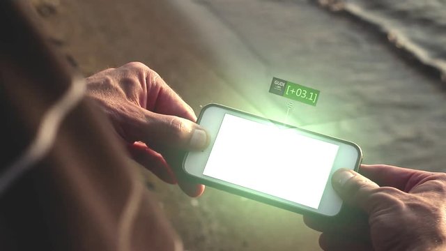 Man watches a futuristic phone displaying hologram of a rising stock market value