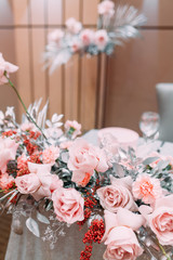 Decor, wedding tables in the restaurant. Floristry, arch and flowers in the design.