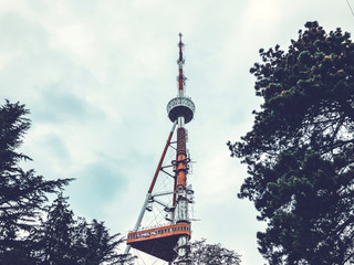 Obraz premium TV tower on the sky background in Mtatsminda Park on the funicular