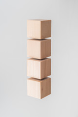 Abstract floating wooden cube on white background