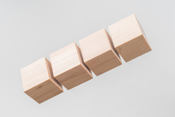 Abstract floating wooden cube on white background