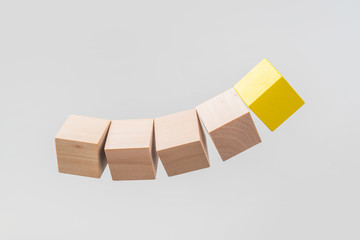 Abstract floating wooden dice on white background