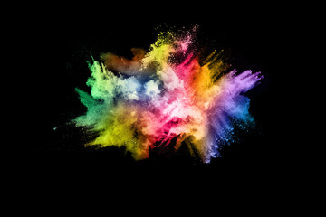 abstract colored dust explosion on a black background.abstract powder splatted background,Freeze motion of color powder exploding/throwing color powder, multicolored glitter texture.
