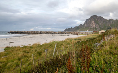 Mountains by the sea in Lofoten, Norway on a cloudy day