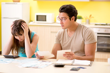 Fototapeta premium Young family struggling with personal finance