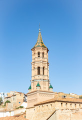 Fototapeta na wymiar Mudejar tower of the Church of Our Lady of the Assumption in Monterde village, province of Zaragoza, Aragon, Spain