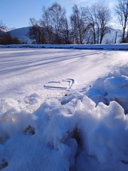 snowy frozen lake with frozen heart and snow blocks / lac gelé enneigé avec coeur glacé et blocs...
