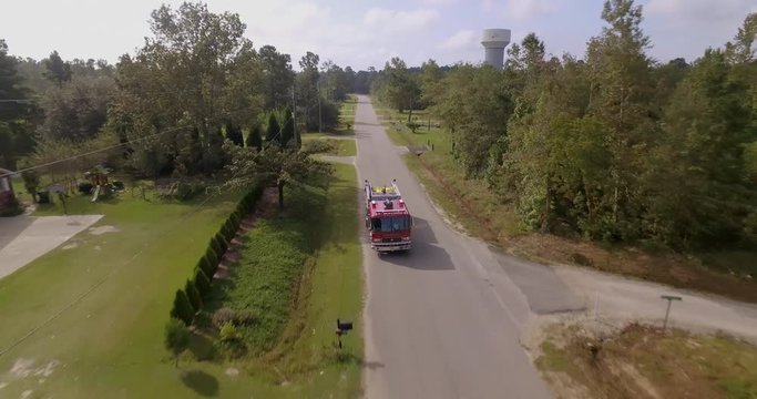 Aerial of firetruck driving on road