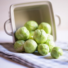 a pile of Brussels sprouts on a white background close up