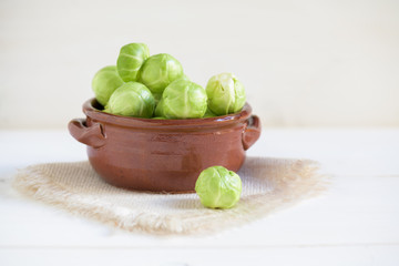 a pile of Brussels sprouts on a white background