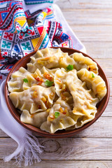 Dumplings, filled with potato. Varenyky, vareniki, pierogi, pyrohy - dumplings with filling