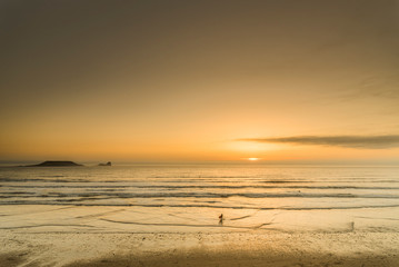 sunset on beach. Rhossili bay. Gower