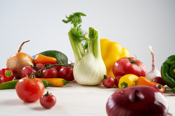 Composition still life of a bunch fresh different seasonal green vegetables avocado, fennel,...