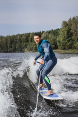 man on wakesurfing. wave from the boat.