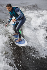 man on wakesurfing. wave from the boat.