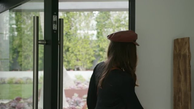 Woman coming back home from a trip / traveling 