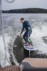 man on wakesurfing. wave from the boat.