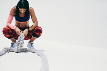 Female athlete taking rest during workout