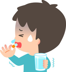 薬を飲む風邪を引いた男性