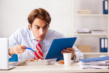 Man having meal at work during break