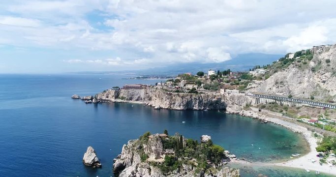 Panoramic aerial view of Cefalu sea port and Tyrrhenian Sea coast, Sicily, Italy. Cefalu city is one of the major tourist attractions in the region. View from Rocca di Cefalu. 4K, 50fps, slowmotion