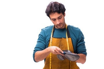 Young handsome shoemaker isolated on white