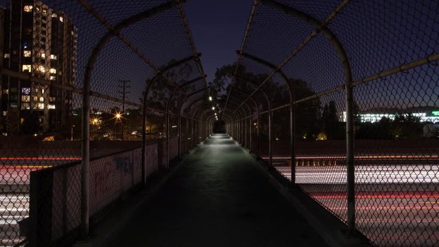 Footbridge Over Freeway Dolly Push Day To Night Timelapse 4k