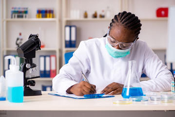 Young black chemist working in the lab 