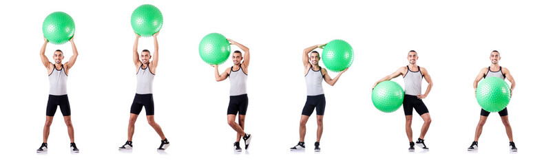 Man with swiss ball doing exercises on white