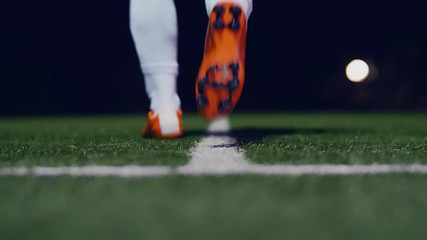 Professional soccer player touches the ground and enters the field, 4k slow motion - Powered by Adobe
