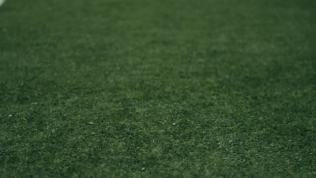 Professional soccer player dribbling with a ball at night. 4k slow motion