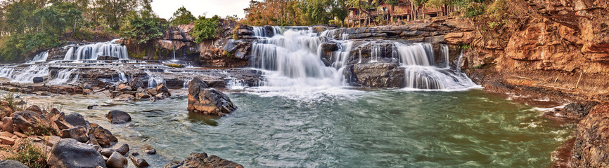Beautiful waterfall in the tropical jungles panoramic sunset view