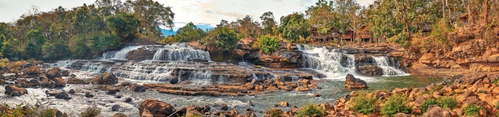 Beautiful waterfall in the tropical jungles panoramic sunset view