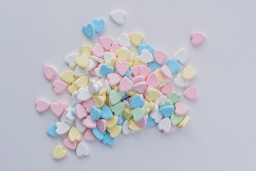 Valentine pastel colourful heart candies in a pile