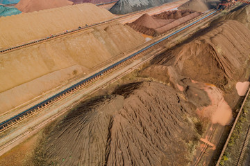 aerial view of ore and conveyor belt at an industrial port