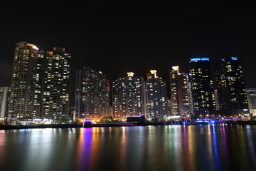 city night skyline with reflection on water