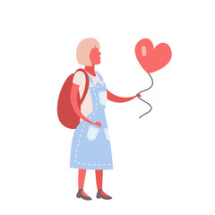 Woman holding red heart shape air balloon
