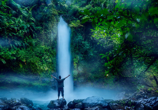 Young man standing near Sawer waterfall