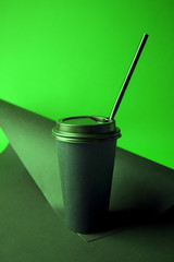 Black Coffee to go cup in vibrant bold gradient holographic colors. Concept art. Minimal hipster surrealism close up, coffee take away concept